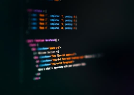 Photo of an IDE with code from Jakub Zerdzicki on Unsplash